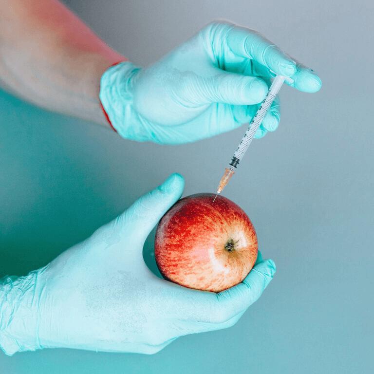 An image of an injection into an apple, referring to taking Liraglutide.
