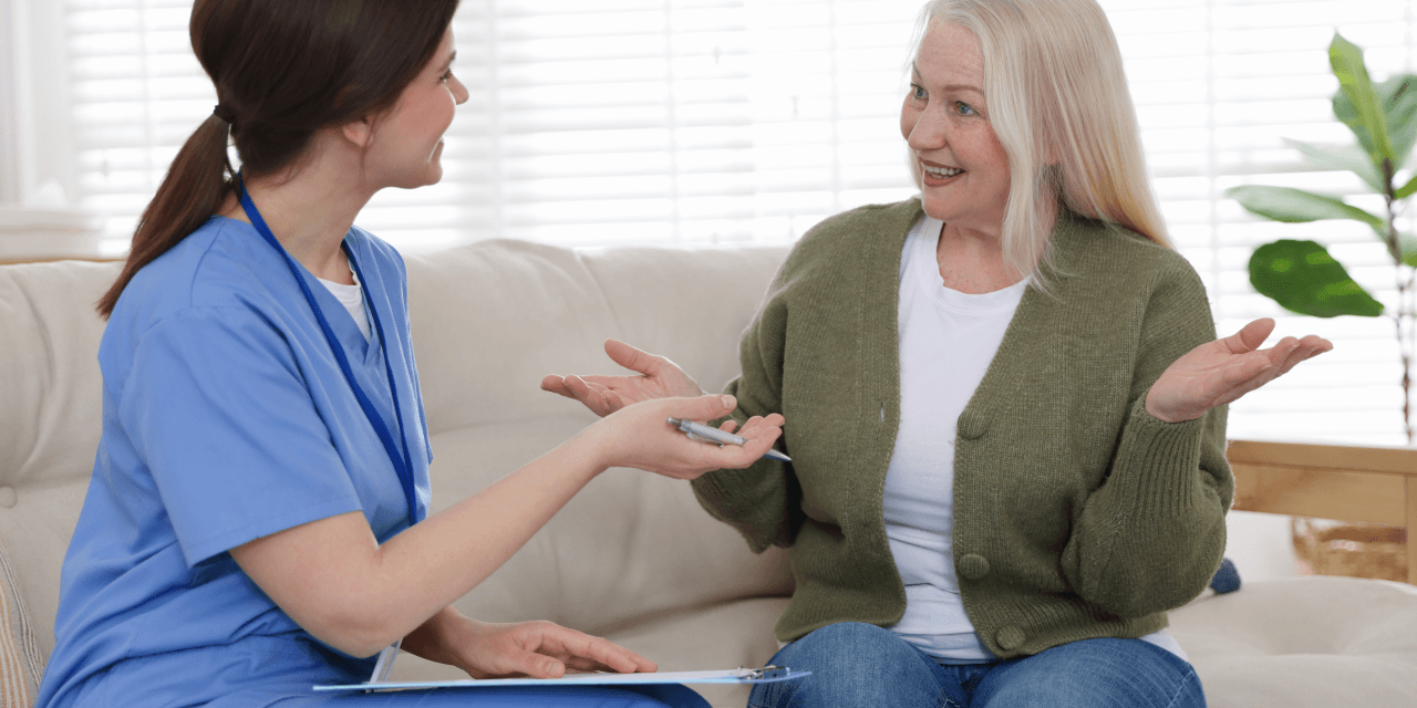 Middle-aged woman talking to her GP