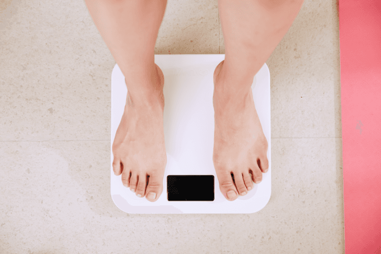Picture showing a feet on scales after someone is trying to lose weight on Semaglutide.