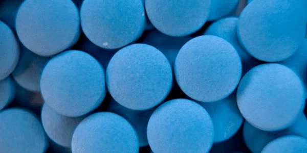 Blue pills that represent the weight loss pill Mysimba.