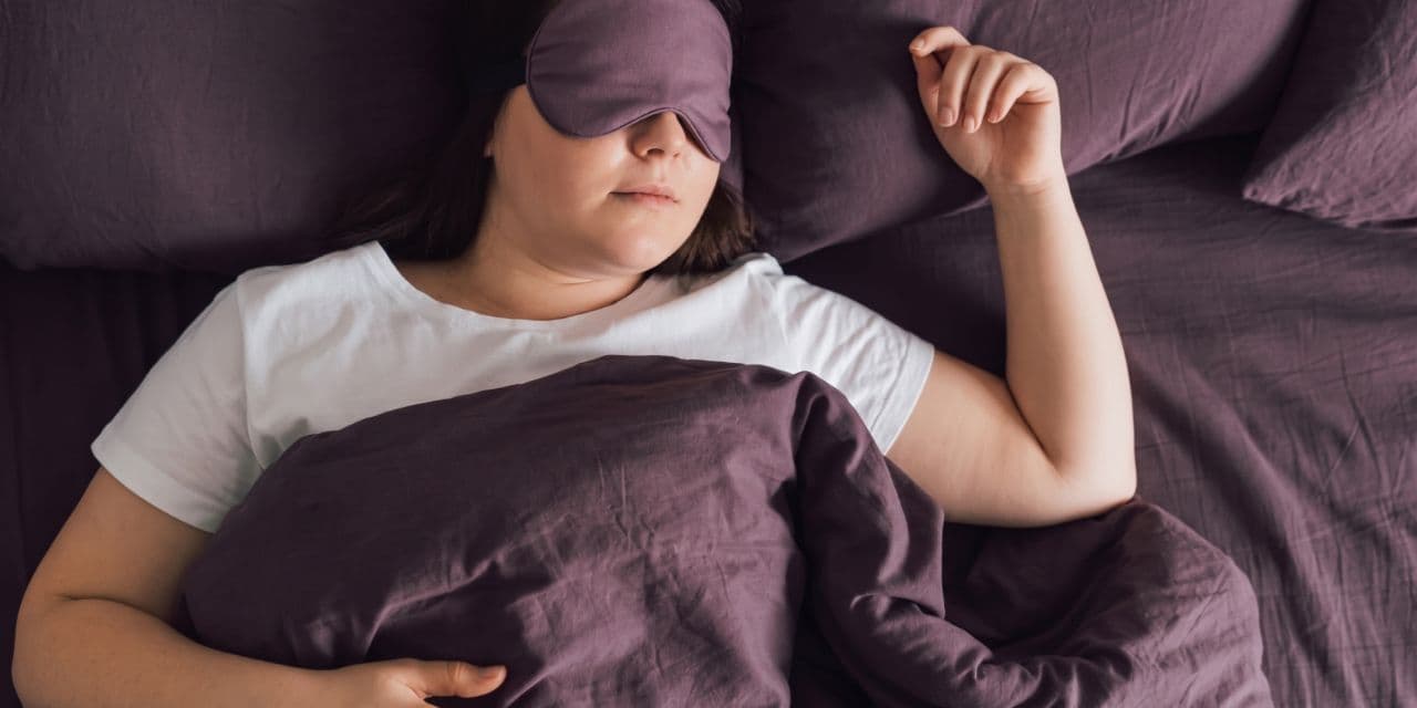 Person sleeping with an eyemask