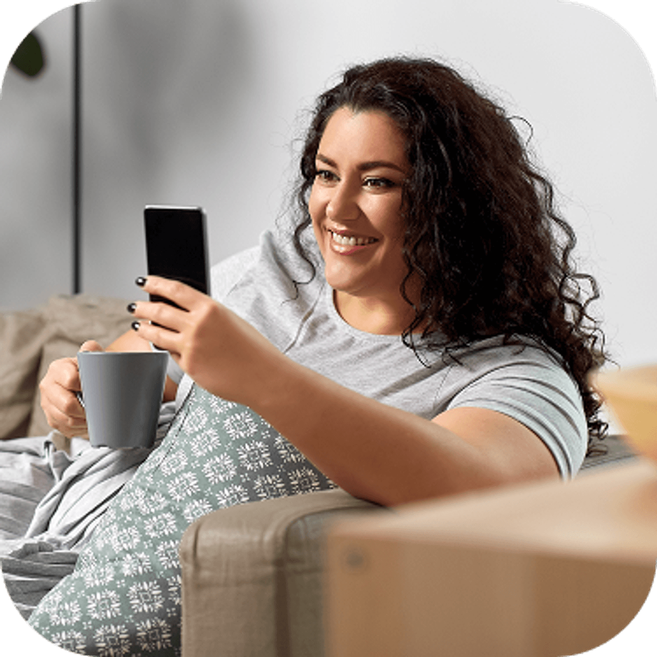 Woman sat looking at her phone