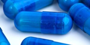 Blue medication capsules