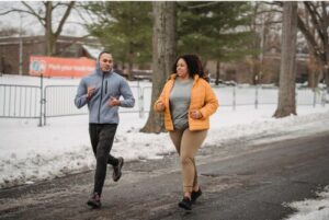 Two people running in a park