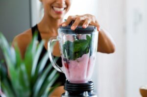 Woman blending a weight loss smoothie