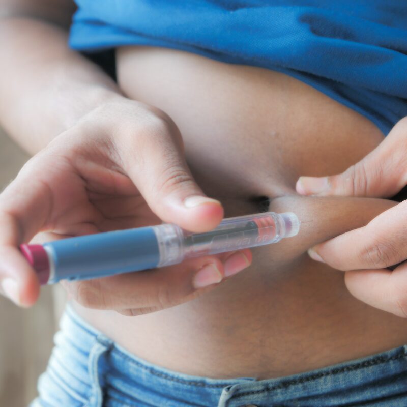 a woman injecting wegovy 7.2mg into her belly